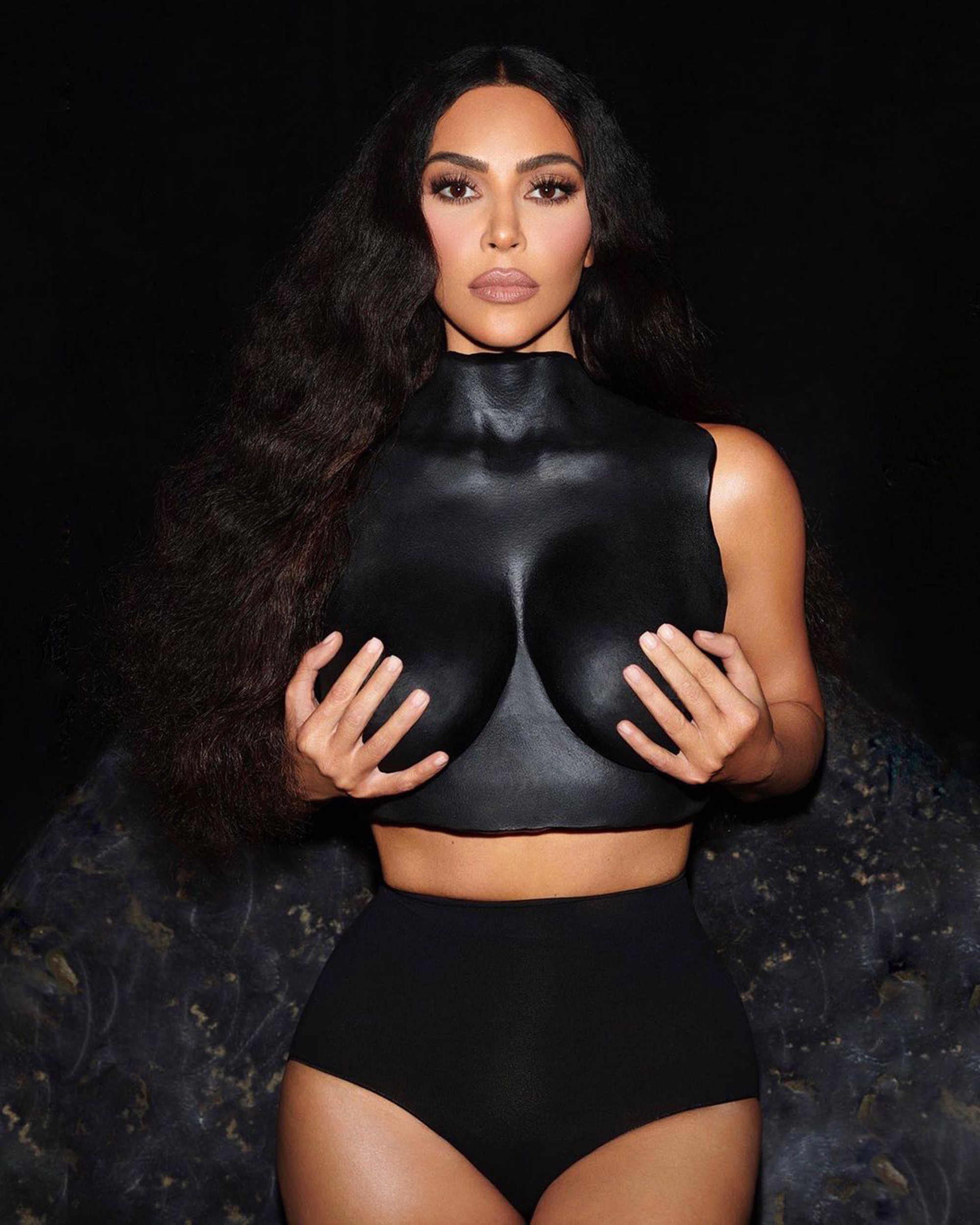 Kim Kardashian with a black breastplate