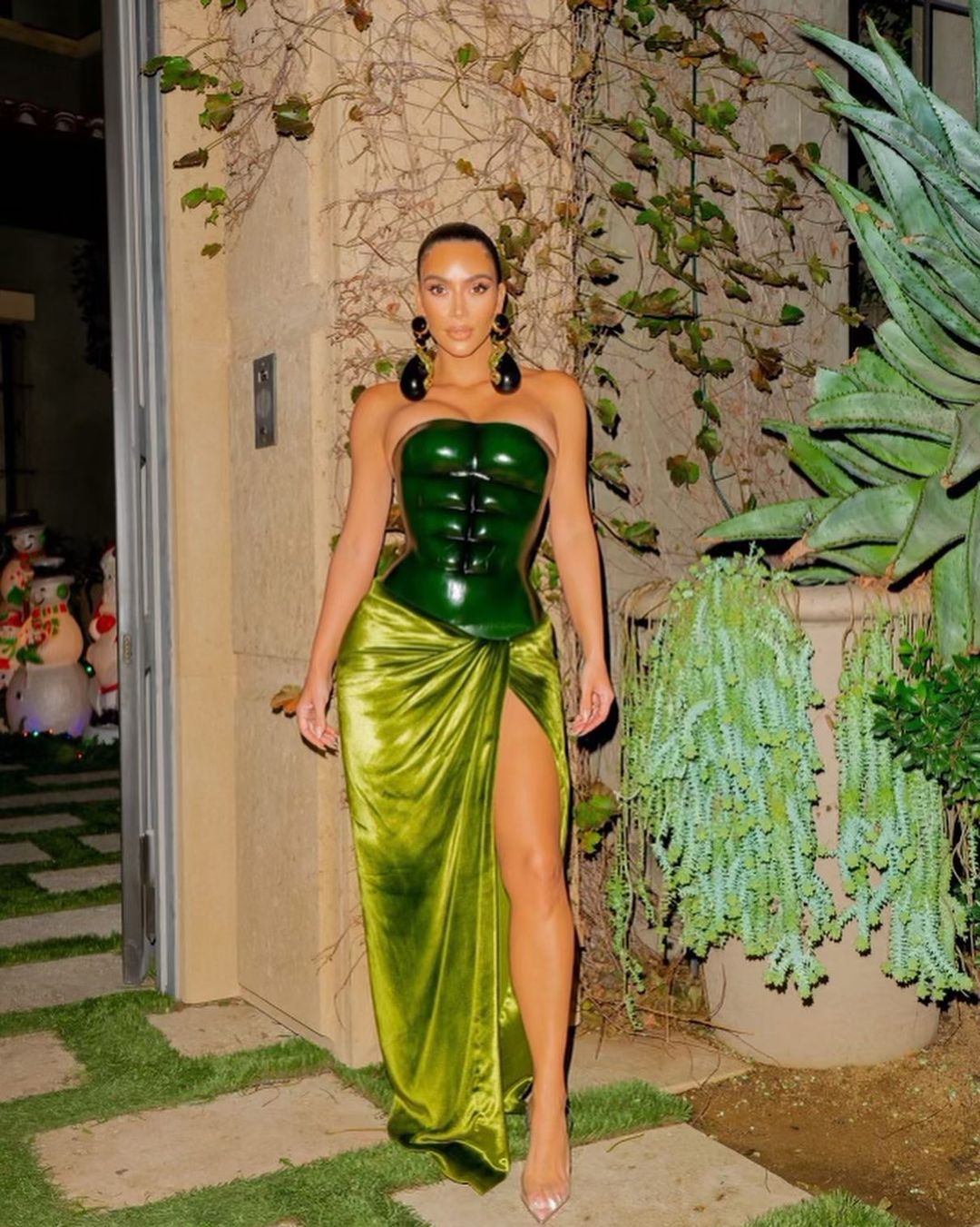 Kim Kardashian wearing a green gown